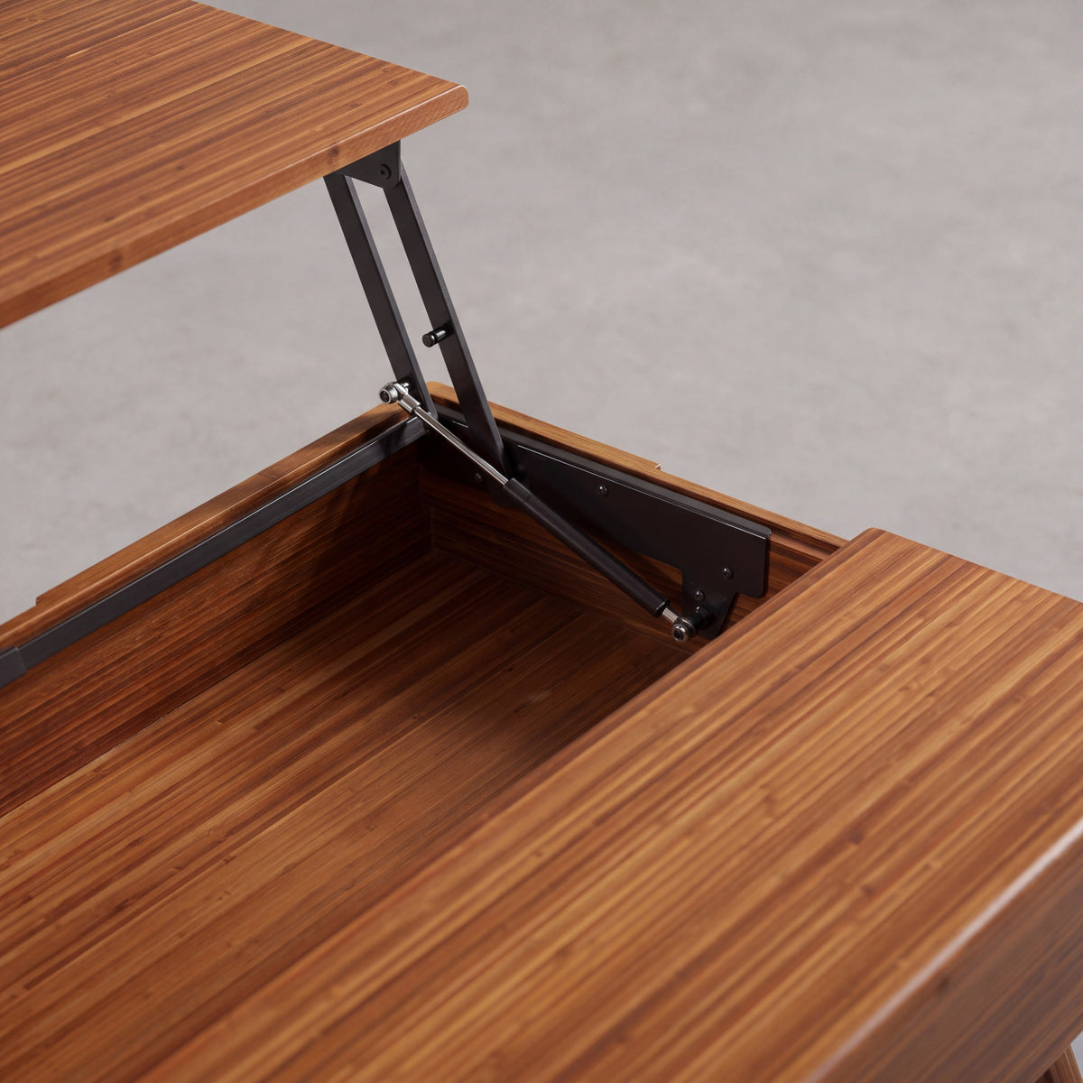 Close-up of the hardware on the Greenington Rhody Lift Top Coffee Table in Amber bamboo