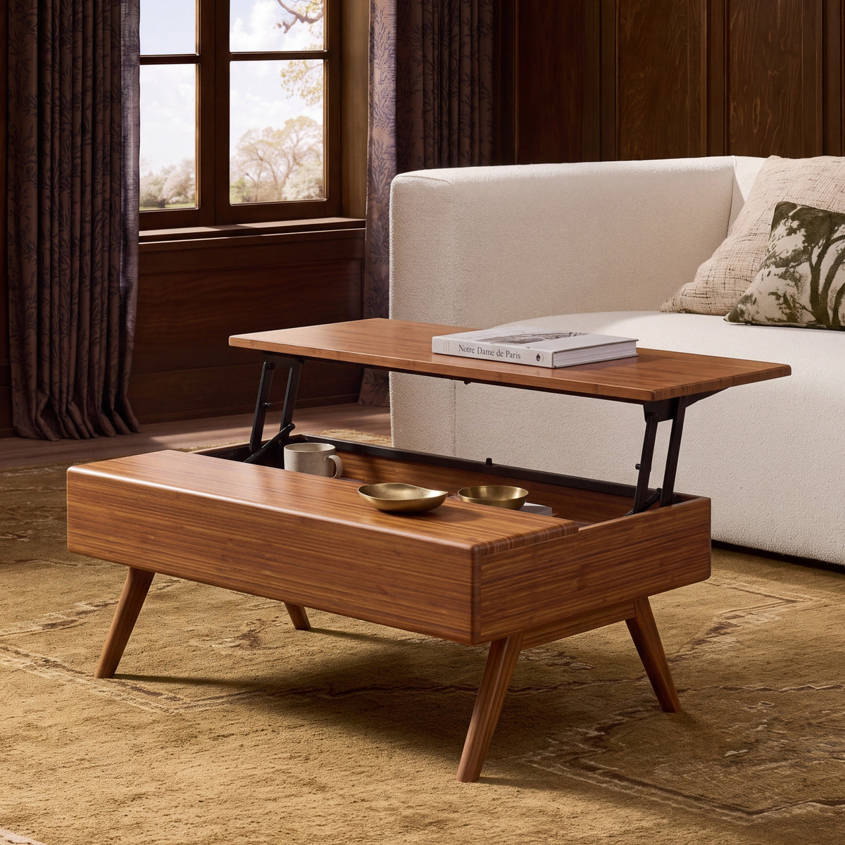 Greenington Rhody Lift Top Coffee Table in Amber bamboo, shown in a living room