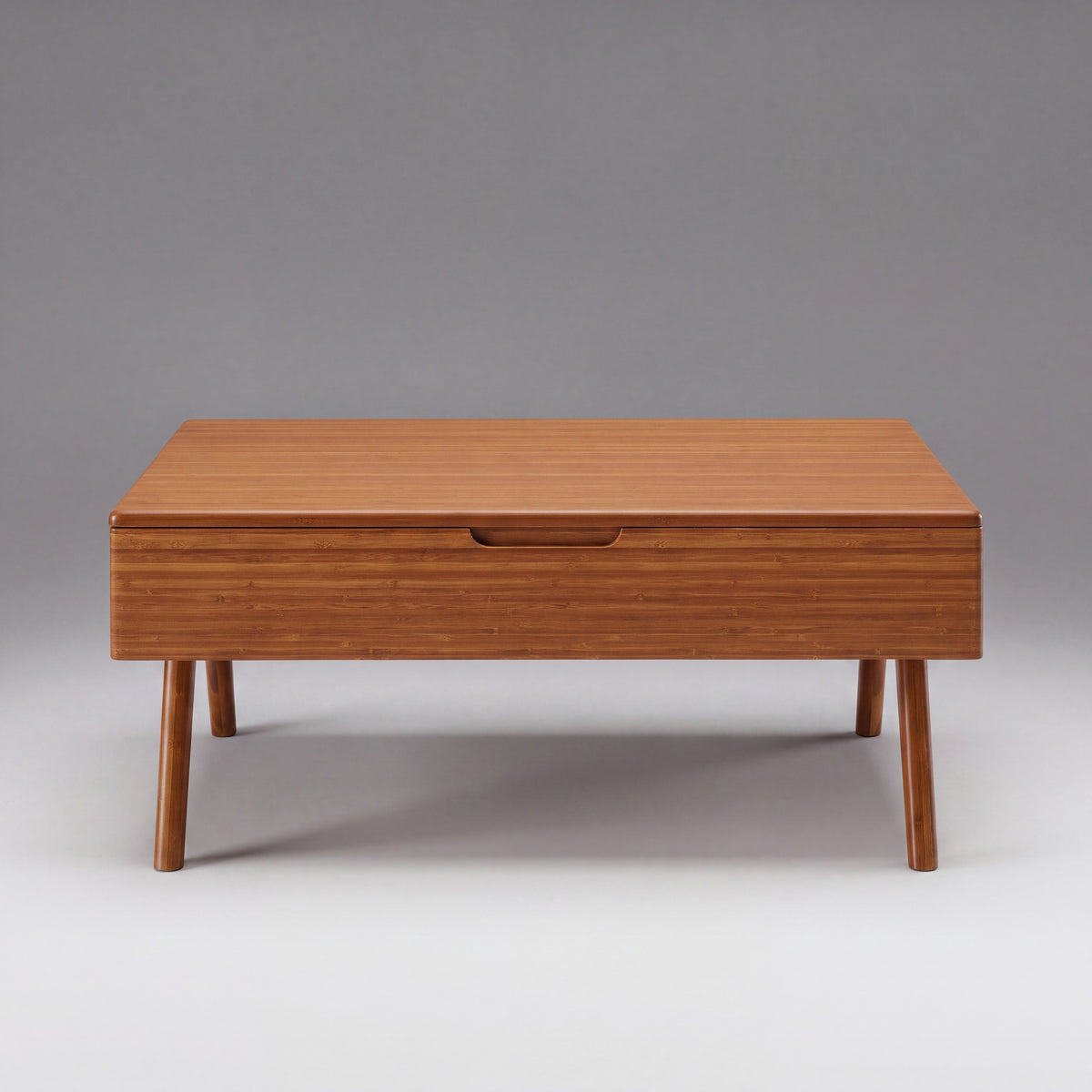 Greenington Rhody Lift Top Coffee Table in Amber bamboo, shown on a plain background