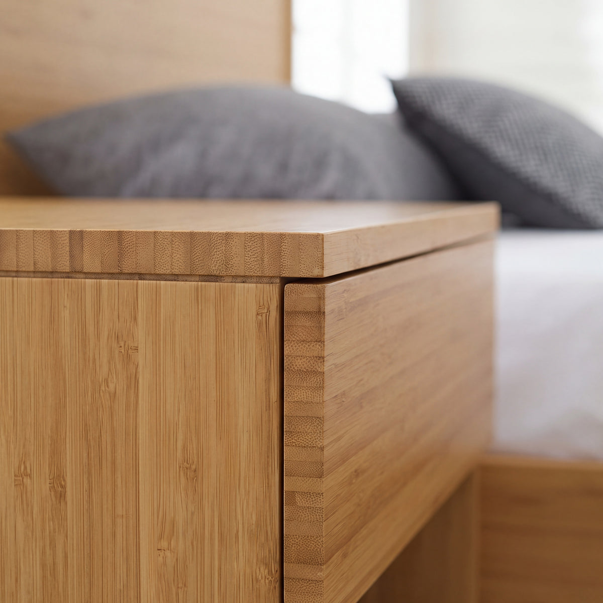 Close-up of the corner joinery on the Greenington Ria Nightstand in Caramelized bamboo