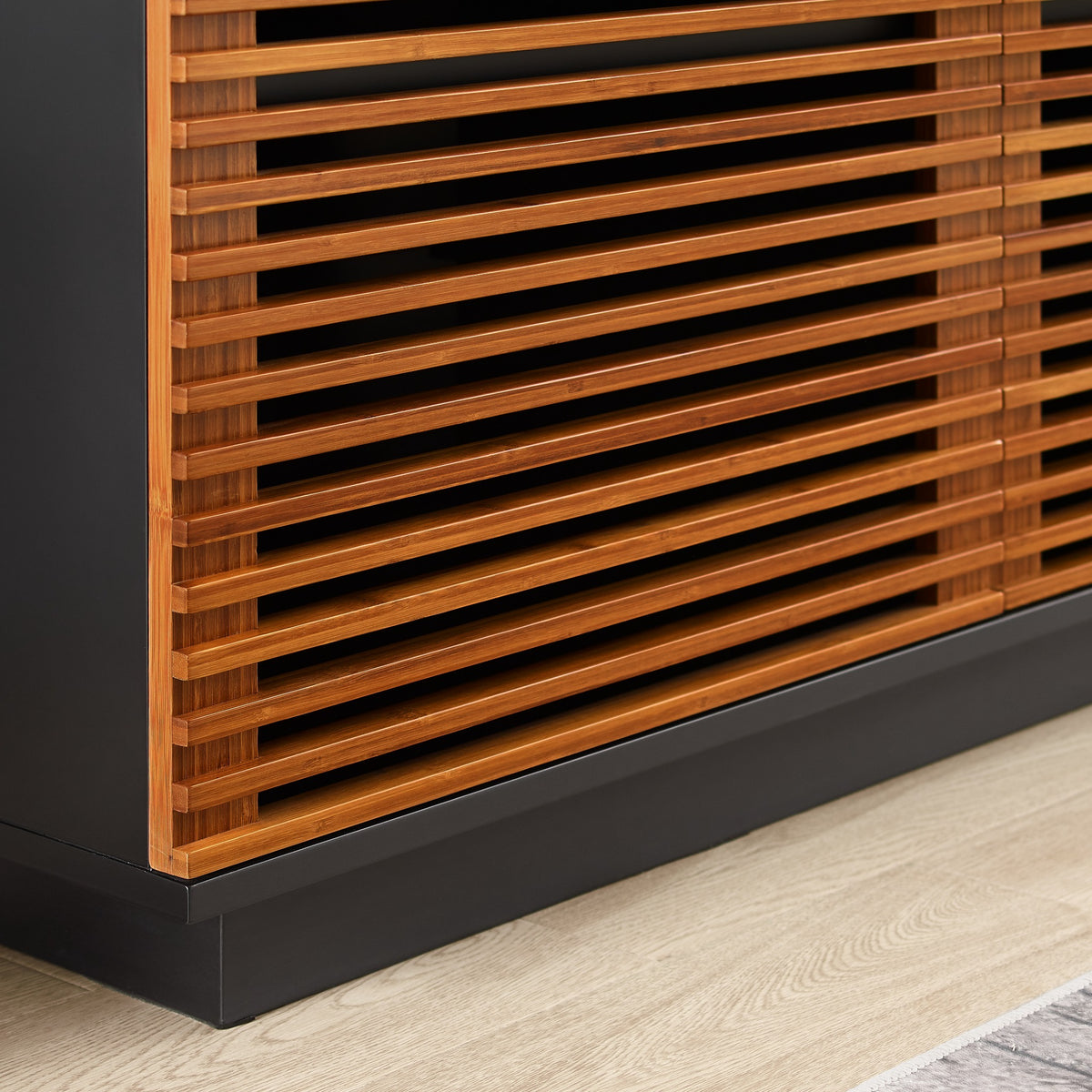 Close-up of the fluted front on the Greenington Rowan Media Center (64") in Amber bamboo