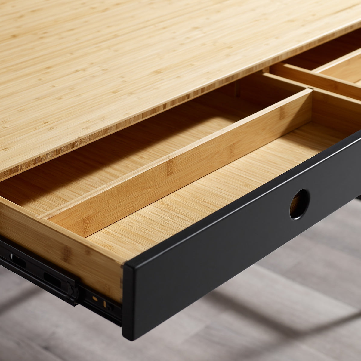 Close-up of the drawer and pull on the Greenington Santa Cruz Writing Desk in Wheat bamboo