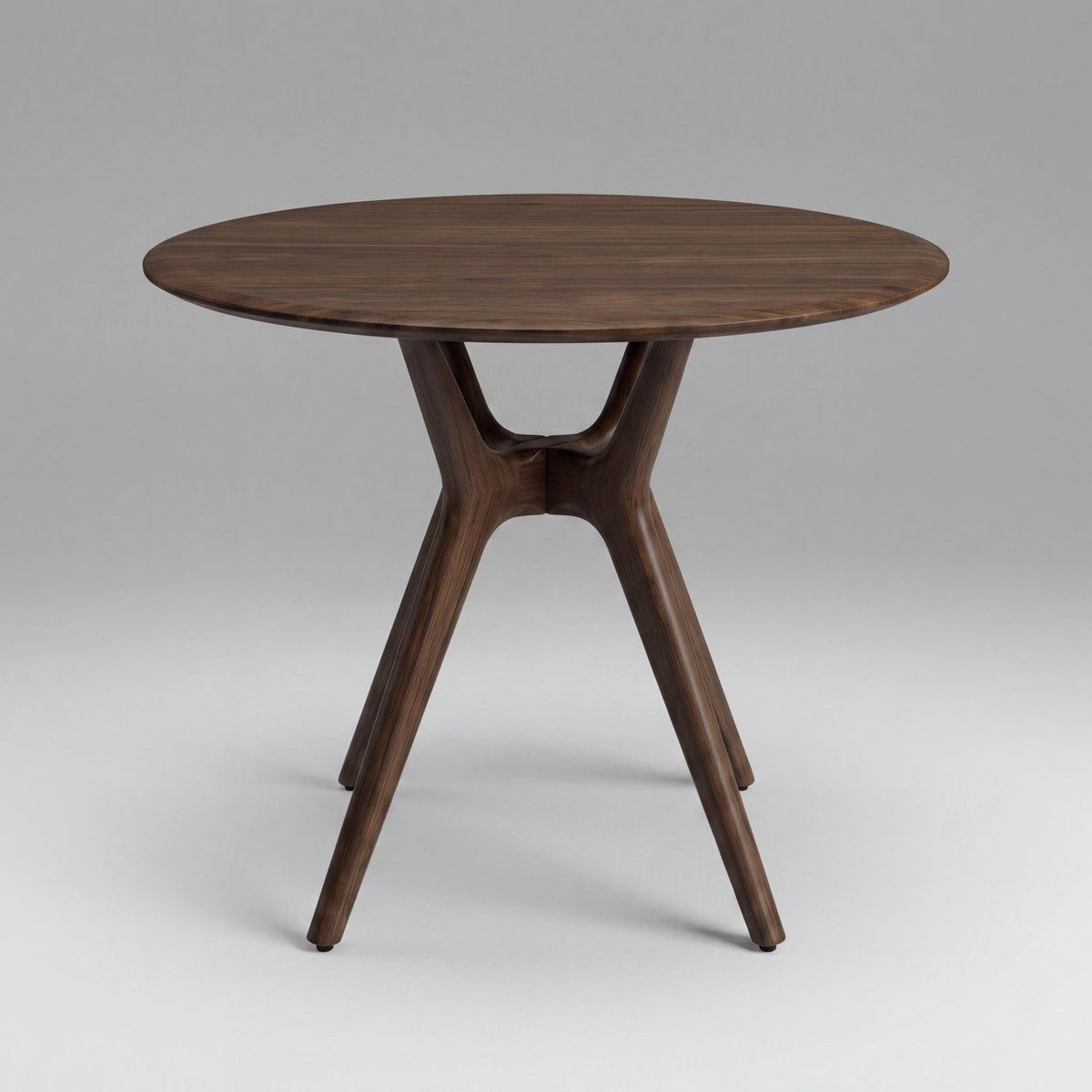 Greenington Sitka Dining Table in Black Walnut bamboo, on a studio background