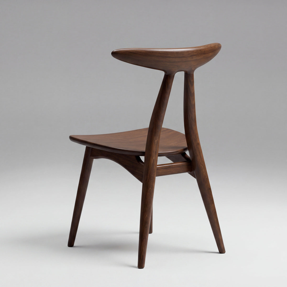 Skagen open-back sculptural chair in Black Walnut