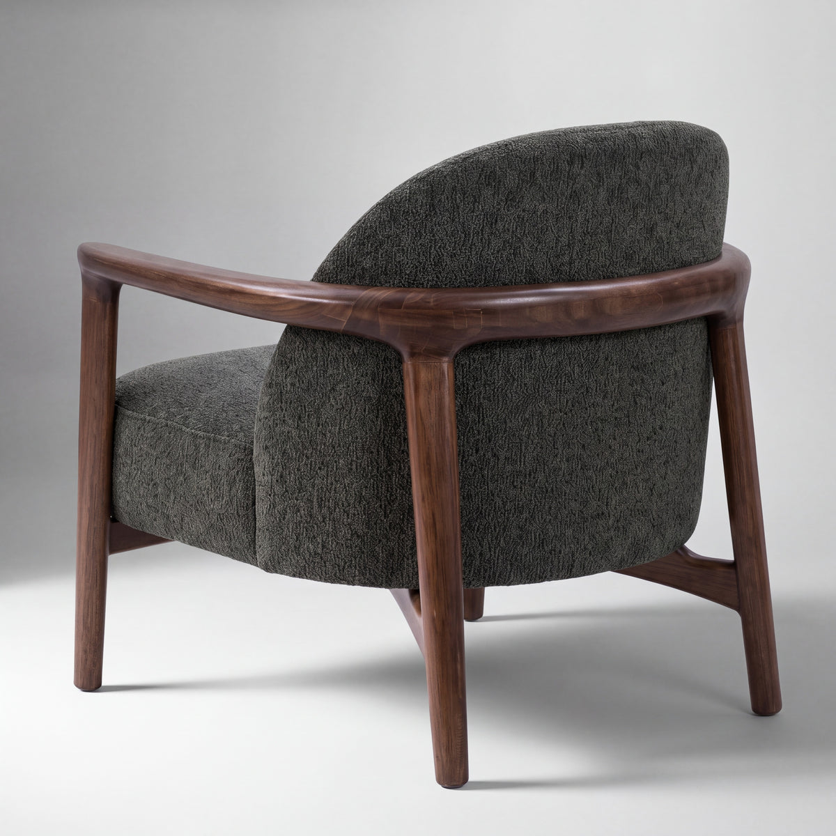 Greenington Skylar Lounge Chair in Black Walnut bamboo with Forest fabric, studio photo on a plain background