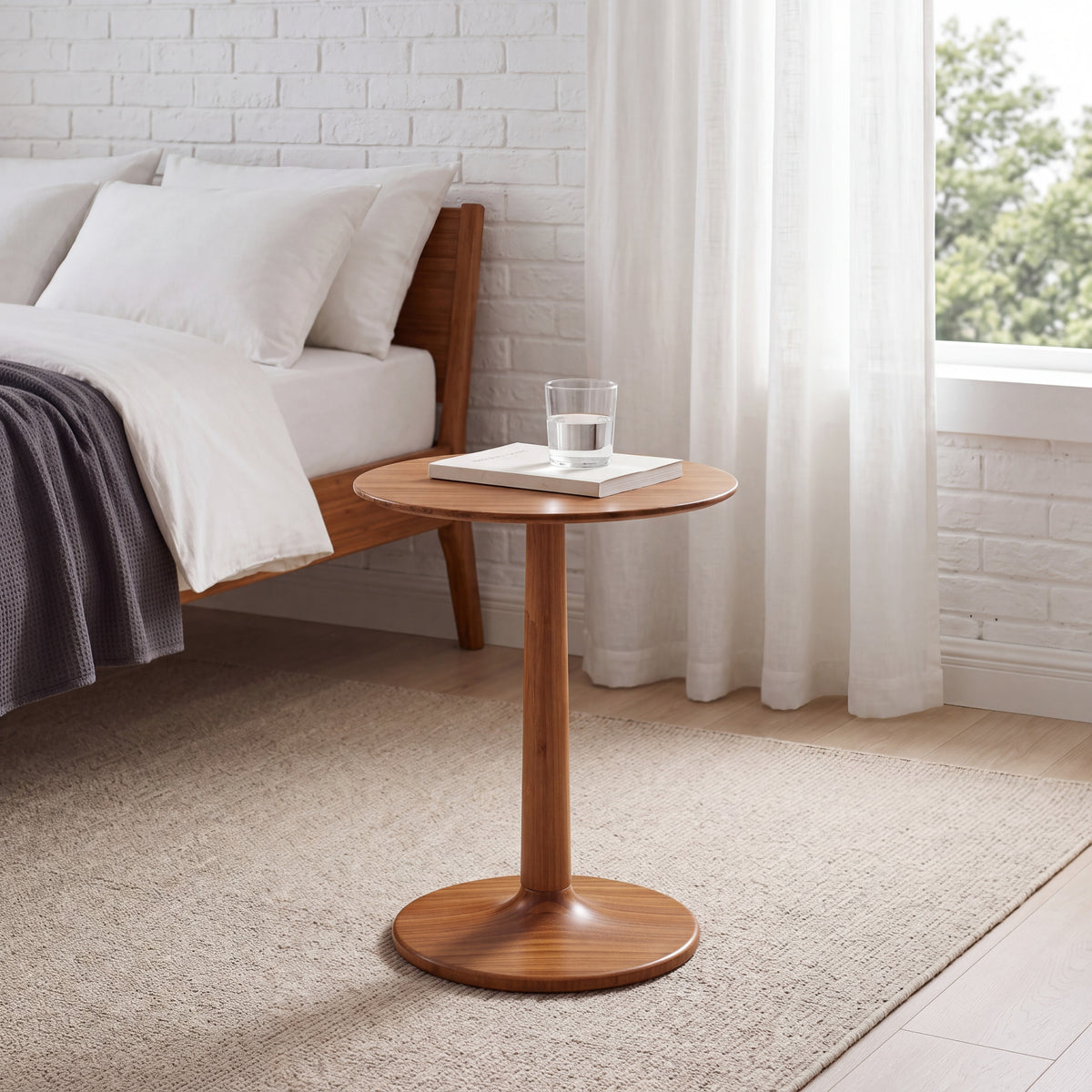 Greenington Sol Side Table in Amber bamboo, styled in a bedroom