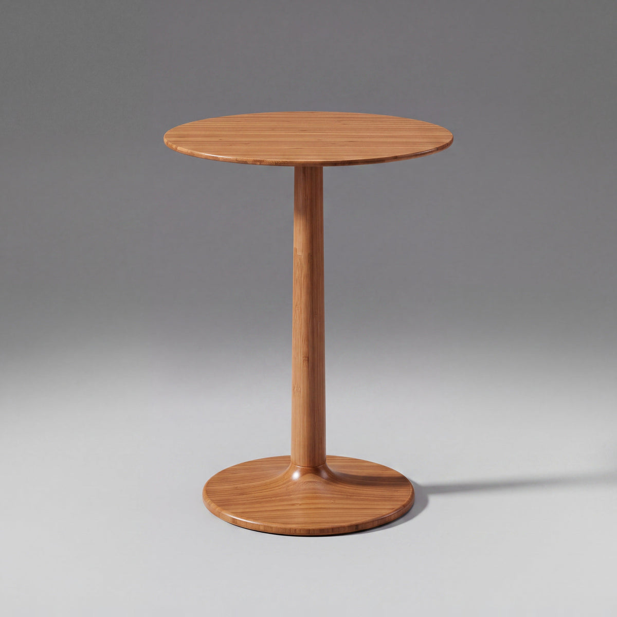 Greenington Sol Side Table in Amber bamboo, on a studio background