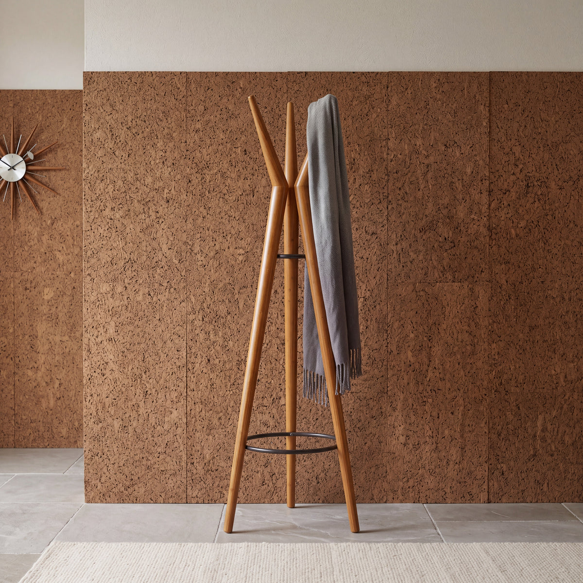Greenington Spire Coat Tree in solid bamboo, in a furnished room setting