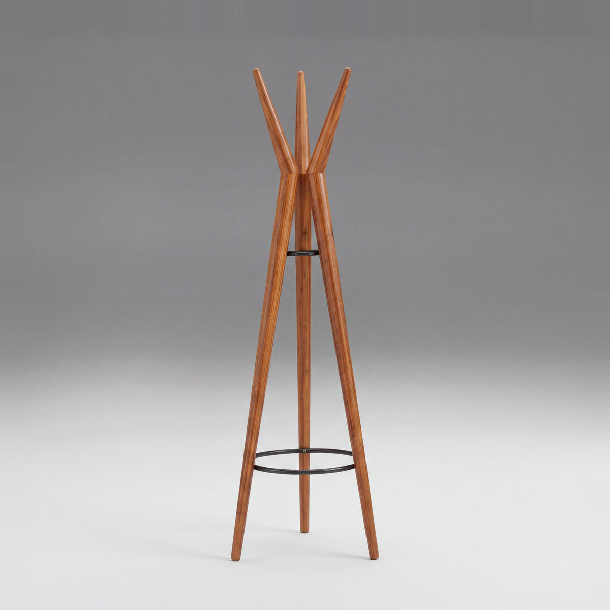 Greenington Spire Coat Tree in solid bamboo, on a studio background