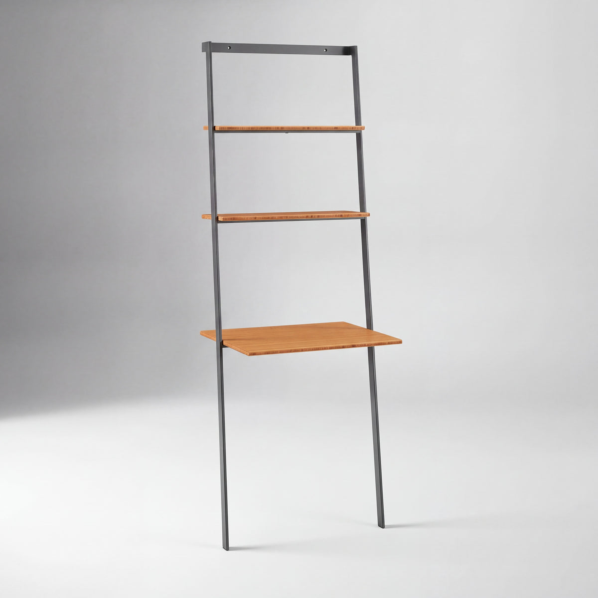 Greenington Studio Plus Leaning Desk in Amber bamboo, on a studio background
