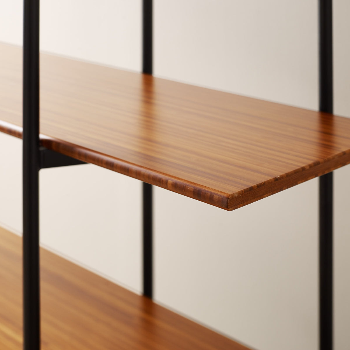 Close-up of the shelves on the Greenington Studio Plus Metal Shelf in Amber bamboo