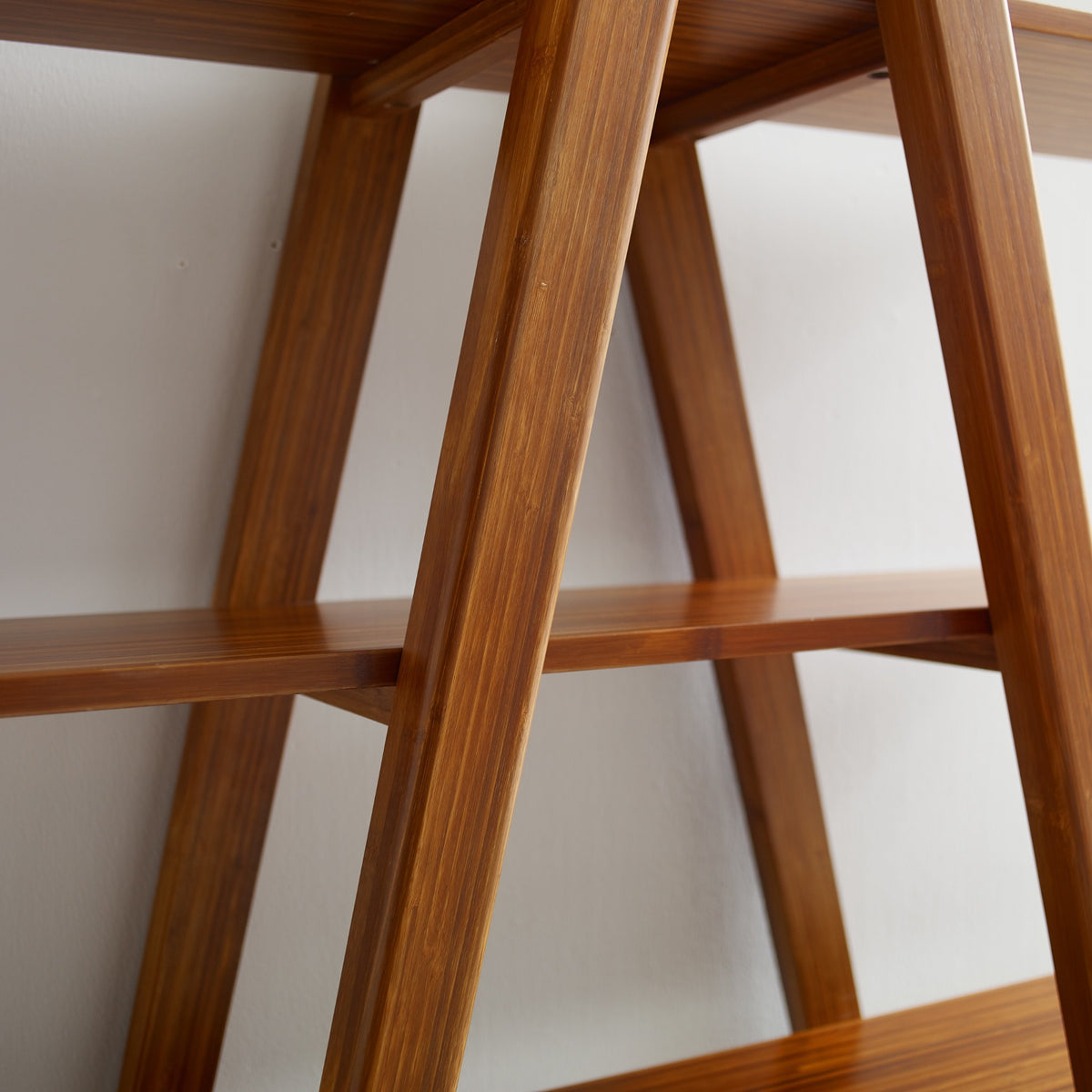 Close-up of the frame on the Greenington Studio Plus Shelf in Amber bamboo
