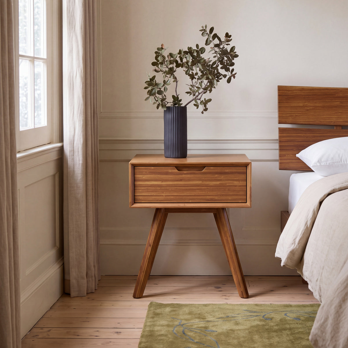 Greenington Summit Nightstand in Amber bamboo, shown in a bedroom