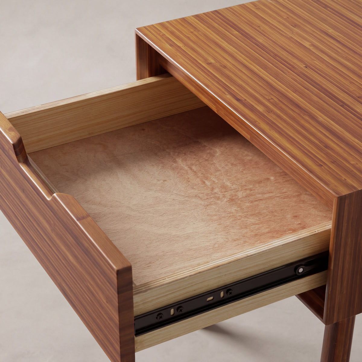 Close-up of the drawer joinery on the Greenington Summit Nightstand in Amber bamboo
