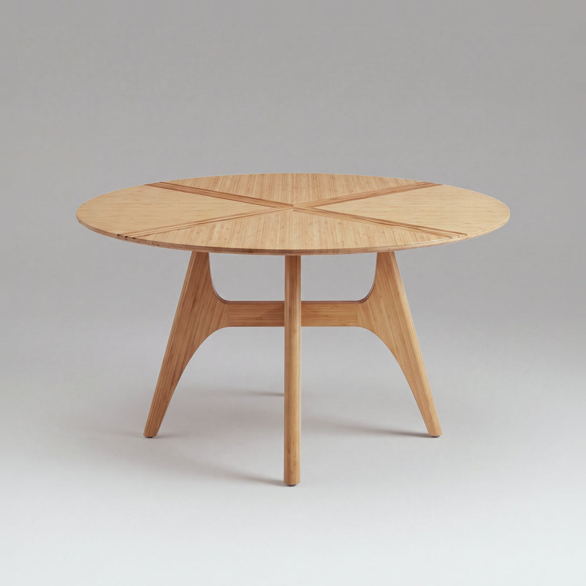 Greenington Suuri Dining Table in Caramelized bamboo, on a light studio background