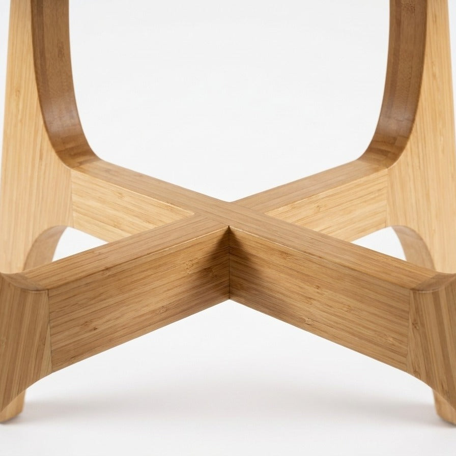 Detail of the leg on the Greenington Suuri Dining Table in Caramelized bamboo