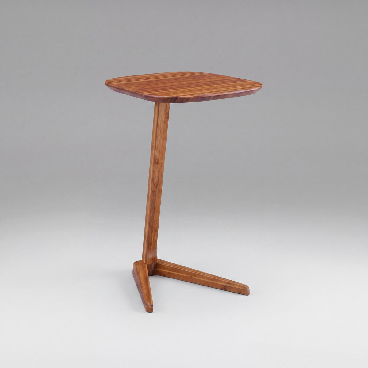Greenington Thyme Side Table in Amber bamboo, on a studio background