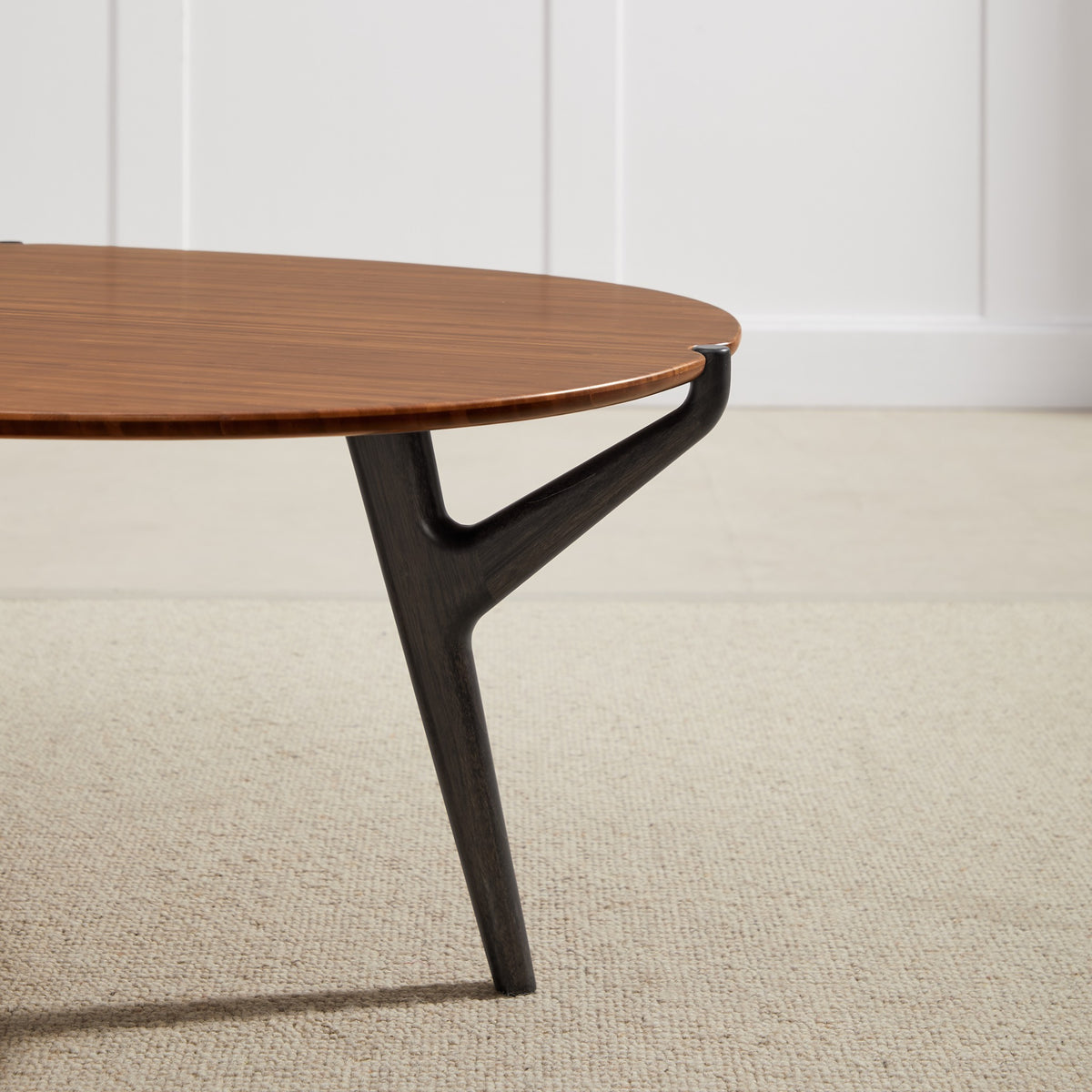 Close-up of the leg on the Greenington Tofino Coffee Table in Amber bamboo