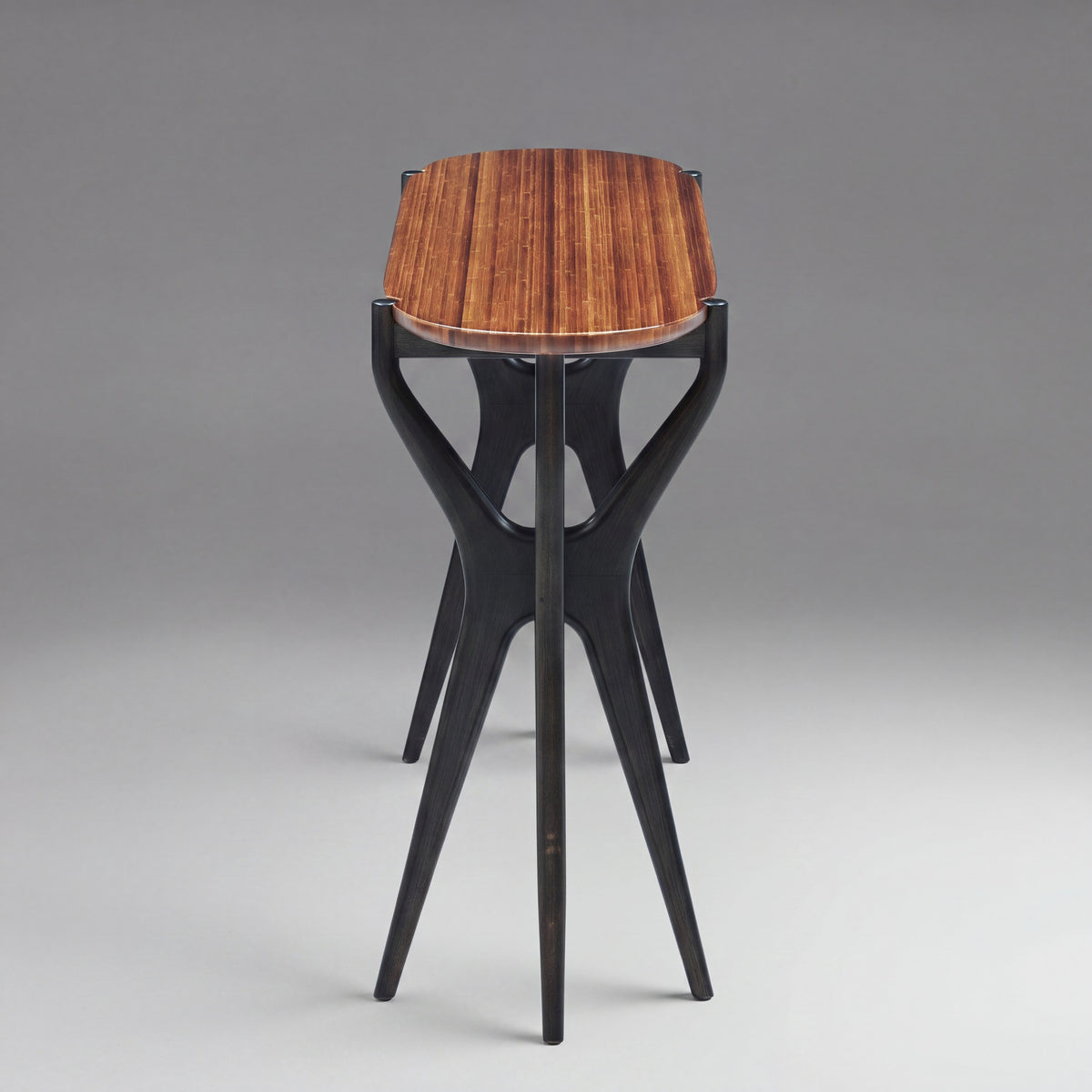 Greenington Tofino Console Table in Amber and Caviar bamboo, studio photo on a plain background