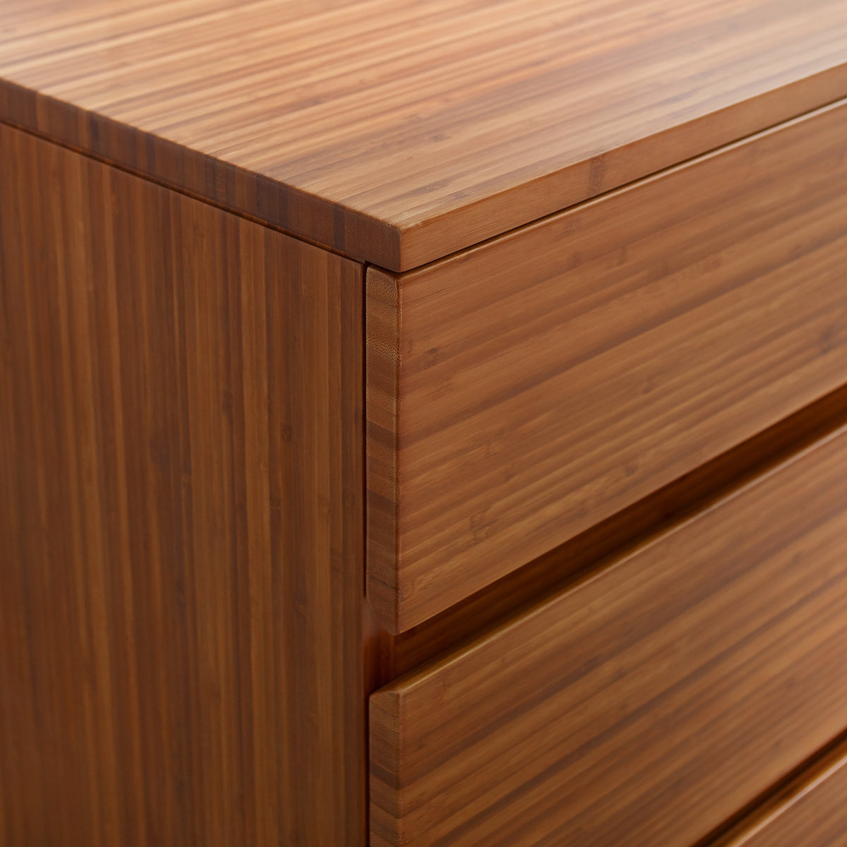 Greenington Ventura Chest in Amber bamboo, styled in a bedroom