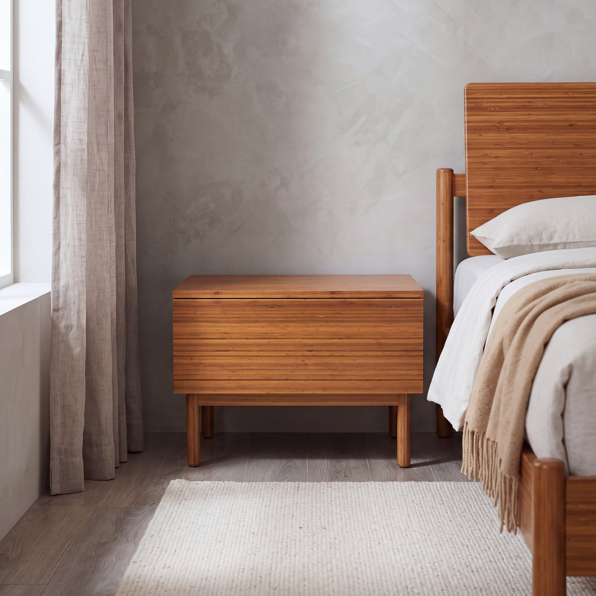 Greenington Ventura Nightstand in Amber bamboo, shown in a bedroom