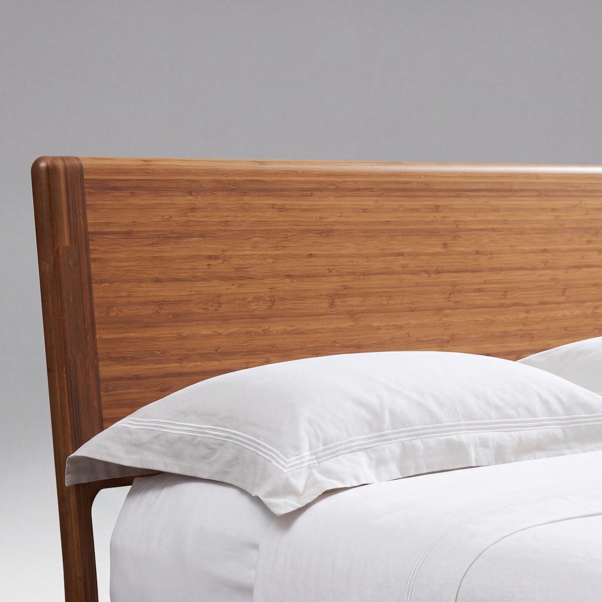 Close-up of the headboard on the Greenington Ventura Platform Bed in Amber bamboo