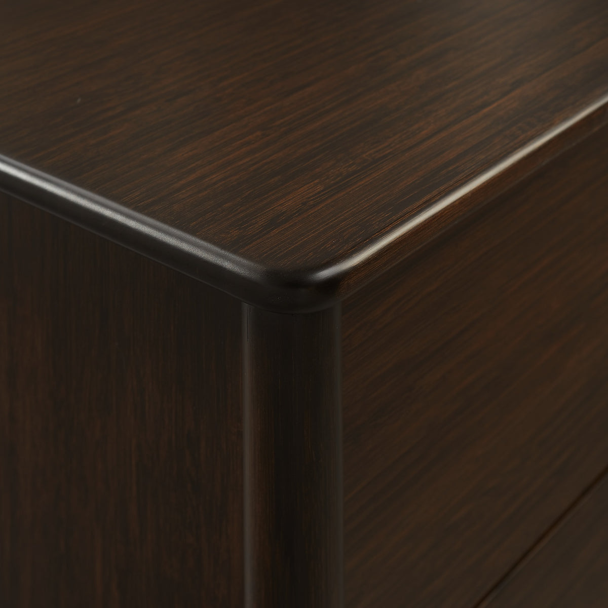 Close-up of the corner joinery on the Greenington Weston Chest in Black Walnut bamboo