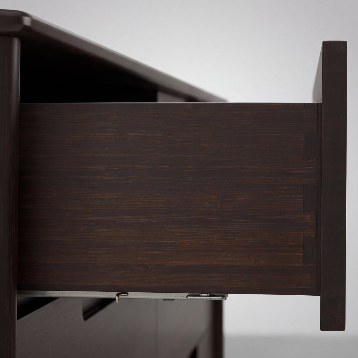 Close-up of the drawer and pull on the Greenington Weston Chest in Black Walnut bamboo
