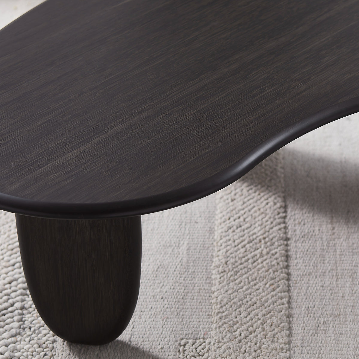 Close-up of the leg on the Greenington Zephyr Coffee Table in Caviar bamboo