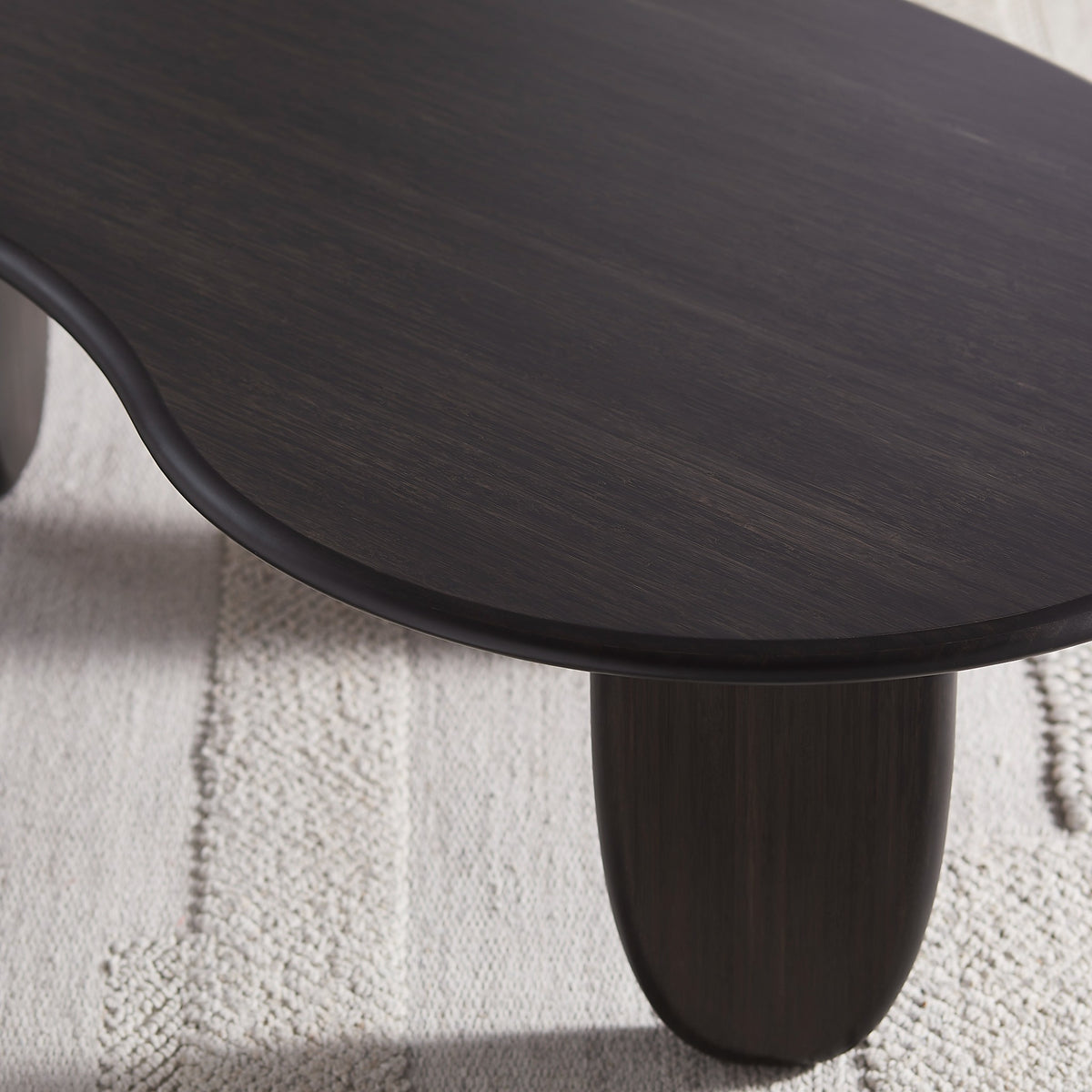 Detail of the leg on the Greenington Zephyr Coffee Table in Caviar bamboo
