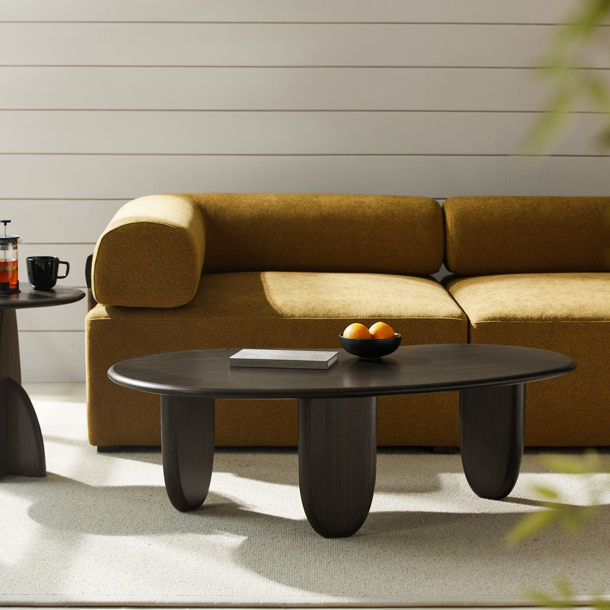 Greenington Zephyr Coffee Table in Caviar bamboo, styled in a living room