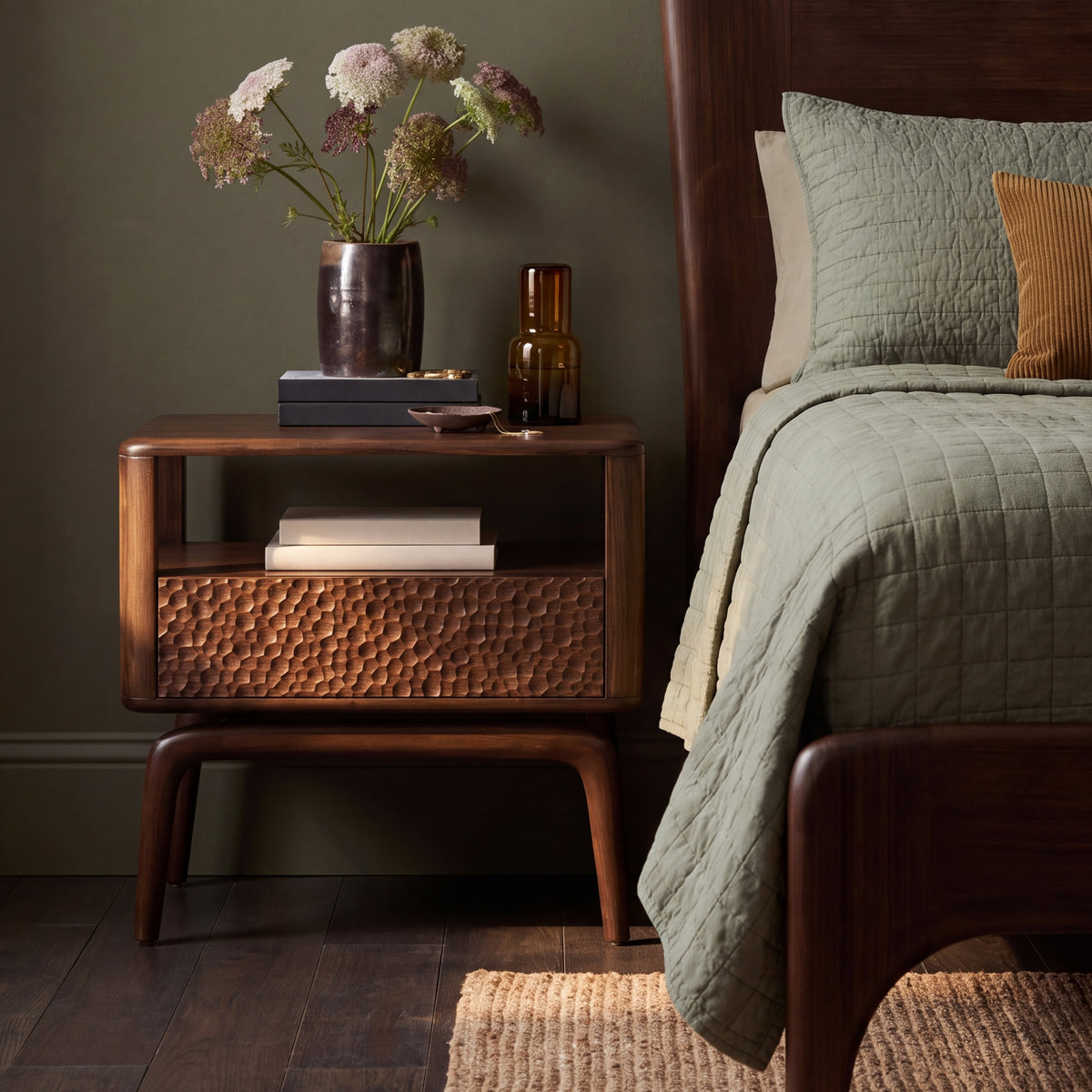Greenington Zeva Nightstand in Black Walnut bamboo beside a Zeva Platform Bed, styled in a dark olive bedroom, front view