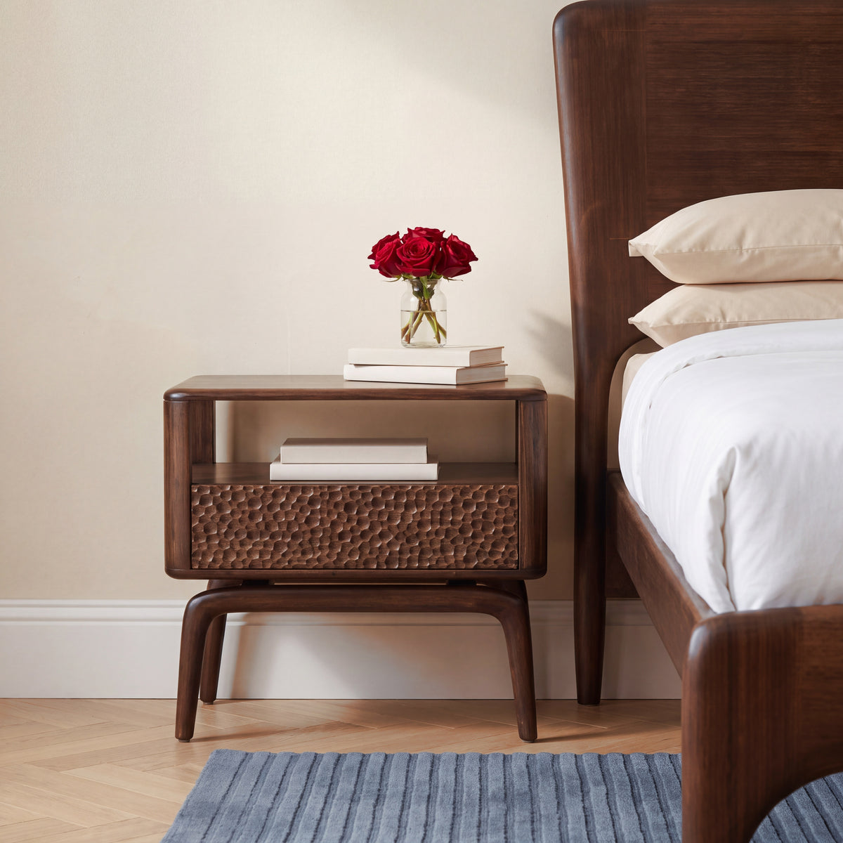 Greenington Zeva Nightstand in Black Walnut bamboo beside a Zeva Platform Bed, styled in a bright bedroom, front view