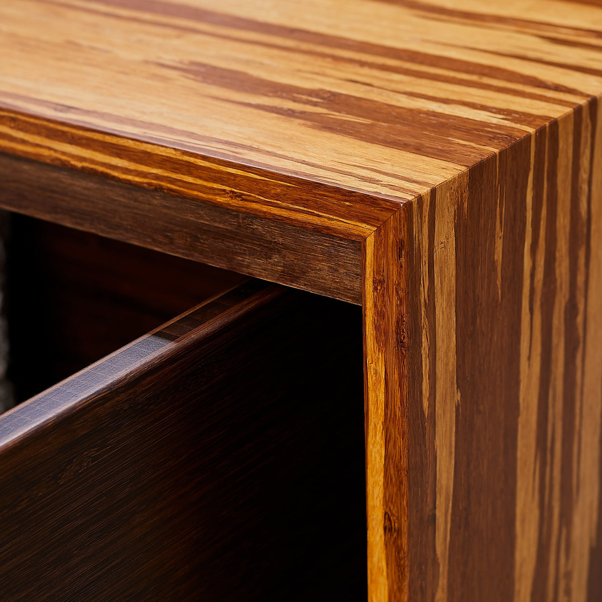 Close-up of the edge profile on the Greenington Azara Cube Rectangular Coffee Table in Sable bamboo