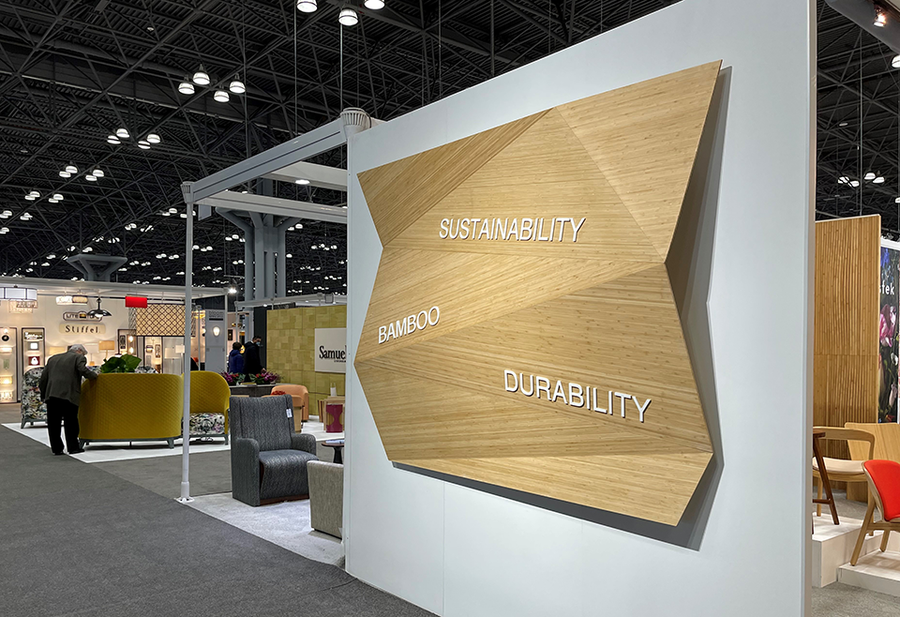 Greenington booth at ICFF 2021, with a carved bamboo wall reading Sustainability, Bamboo, Durability
