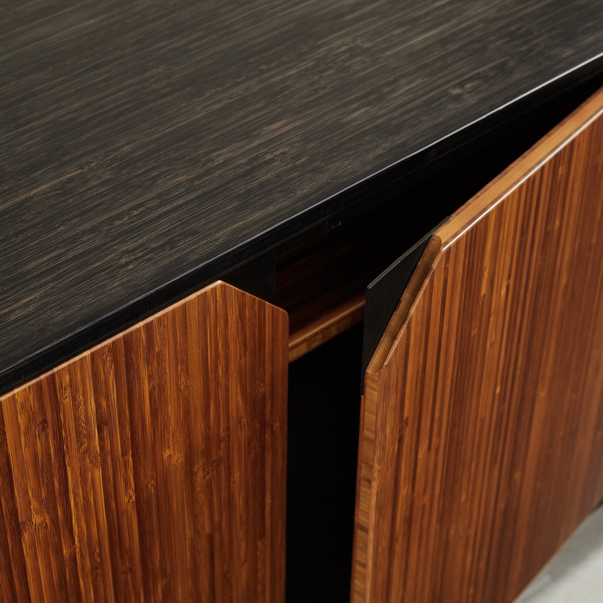 Close-up of the door and handle on the Greenington Sonoma Sideboard/Media/Credenza in Amber and Caviar bamboo