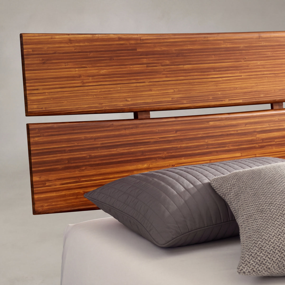 Close-up of the headboard on the Greenington Summit Platform Bed in Amber bamboo