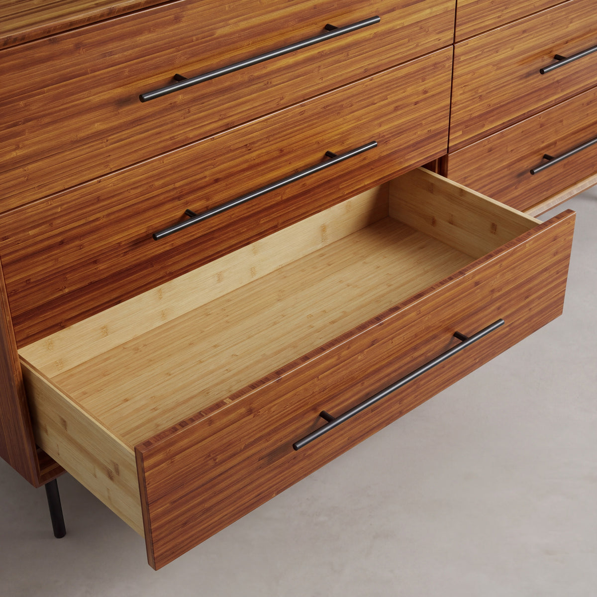 Close-up of the drawer and pull on the Greenington Taylor Dresser in Amber bamboo
