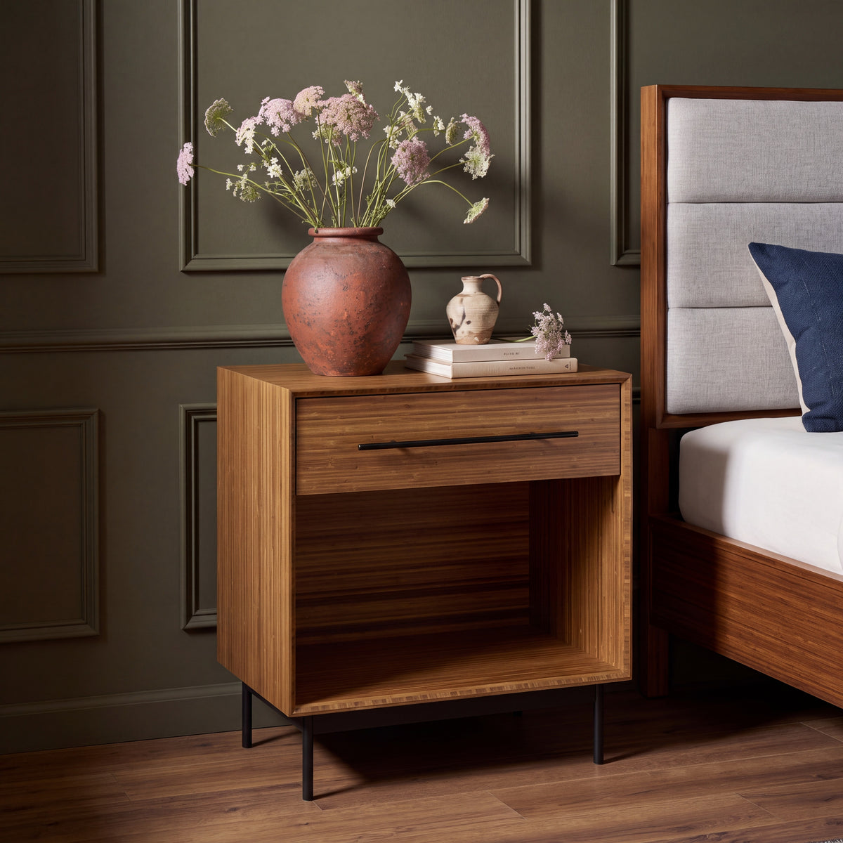 Greenington Taylor Nightstand in Amber bamboo, styled in a bedroom