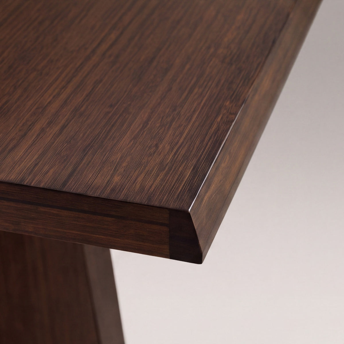 Close-up of the edge profile on the Greenington Torrey Dining Table in Black Walnut bamboo
